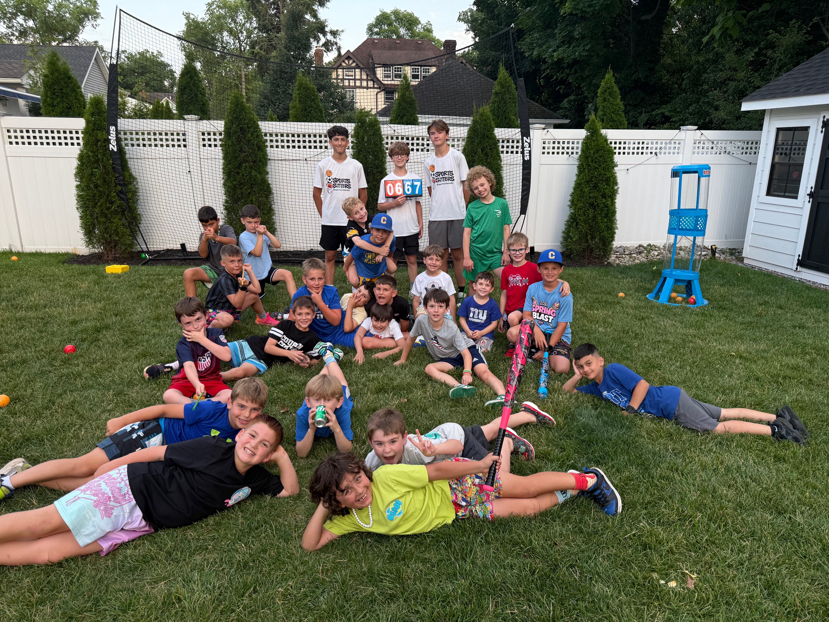 Sports Sitters birthday party with large group of kids in backyard