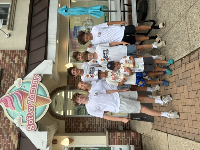 Sports Sitters with kids outside Soft N' Yummy ice cream shop