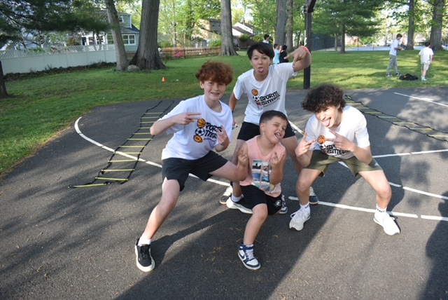 Sports Sitters having fun with kids on agility ladder