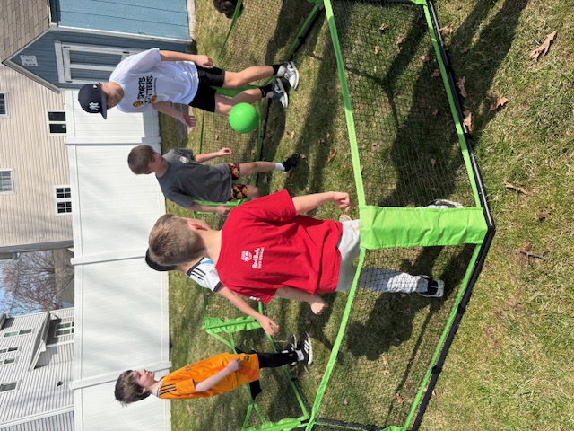 Small group soccer training with pop-up goal