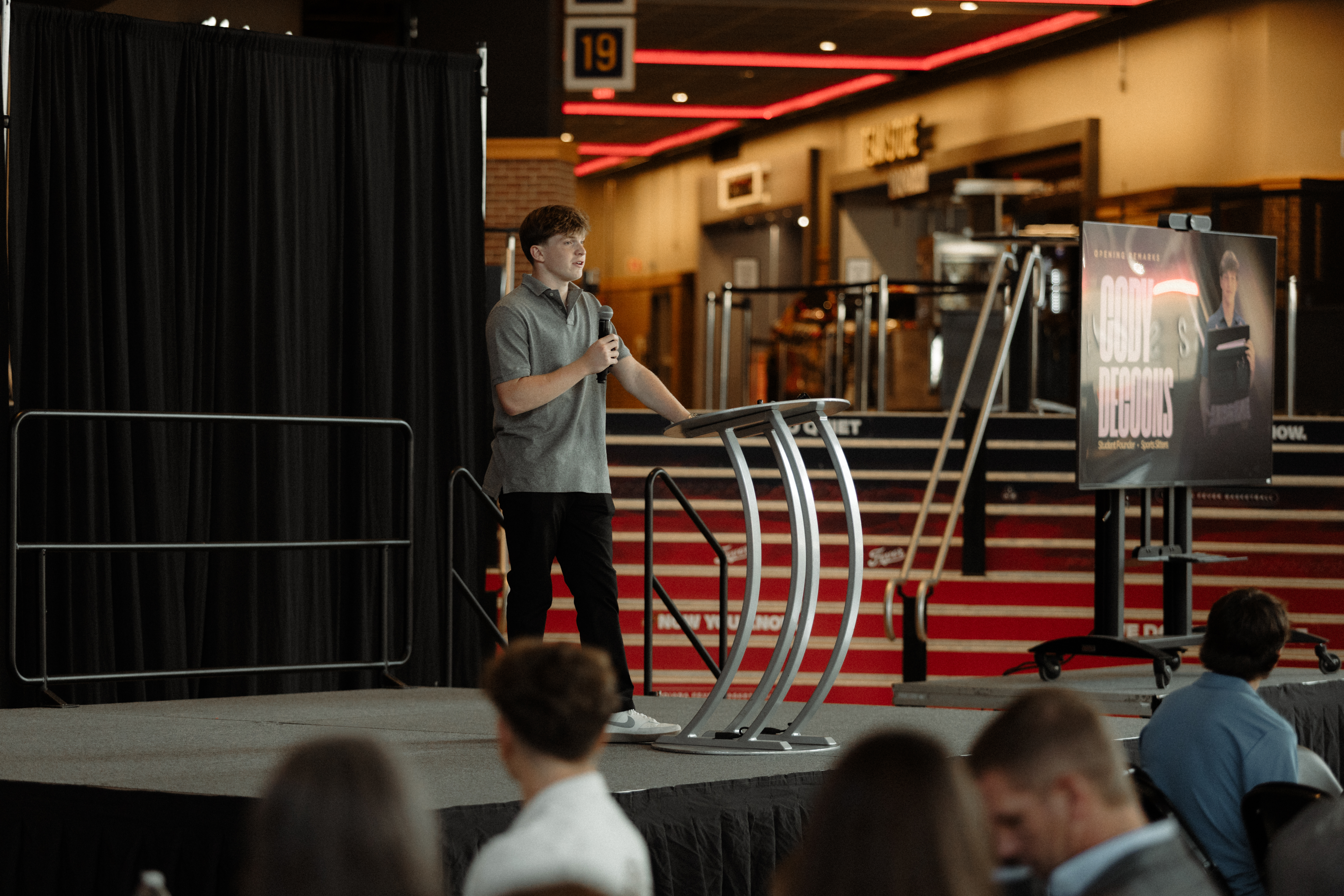 Cody DeCoons on stage at the High School Hustle Awards Ceremony