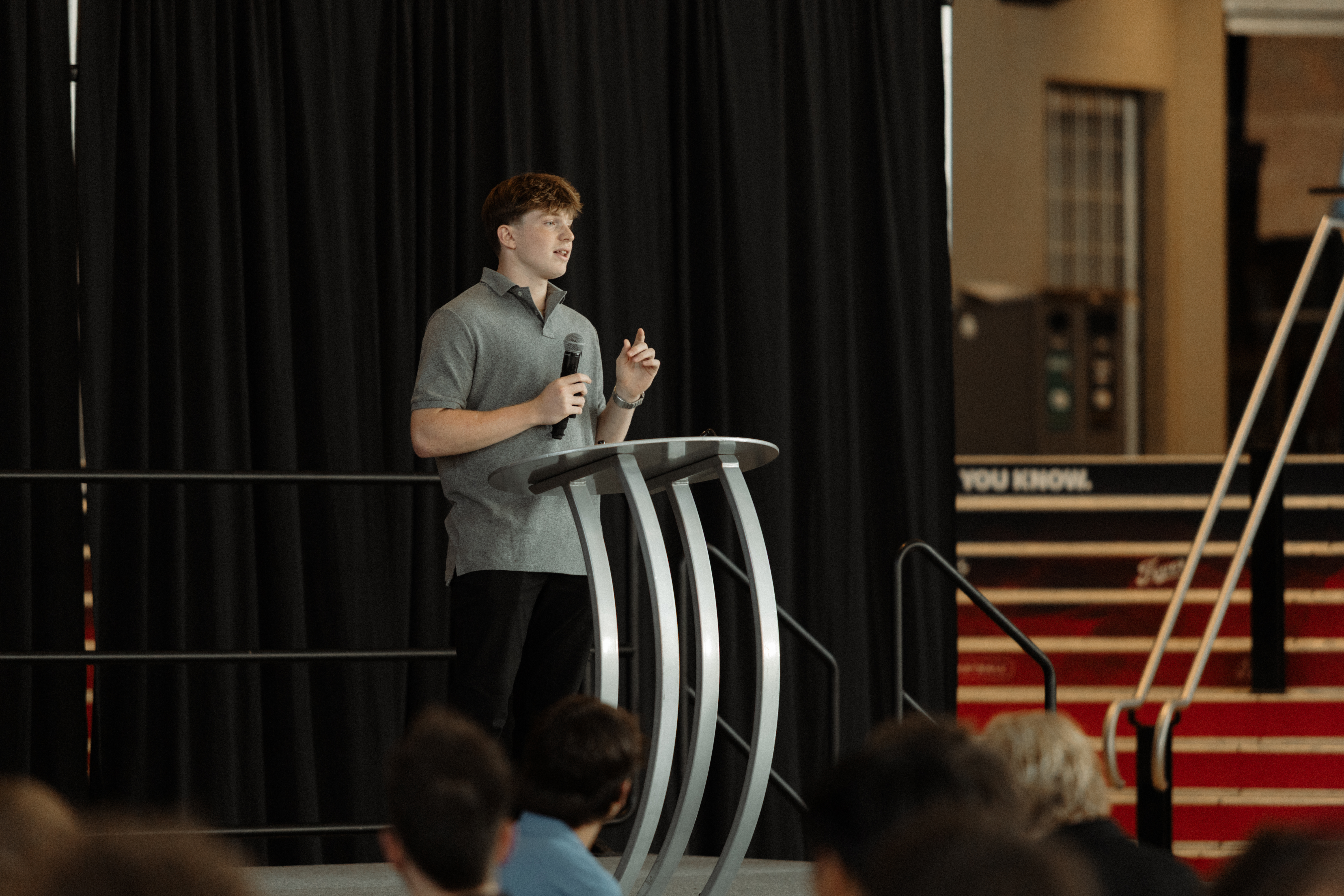 Cody DeCoons speaking at the High School Hustle Awards Ceremony