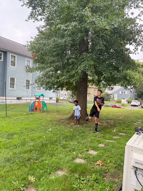 Sports Sitter and young athlete with baseball gloves