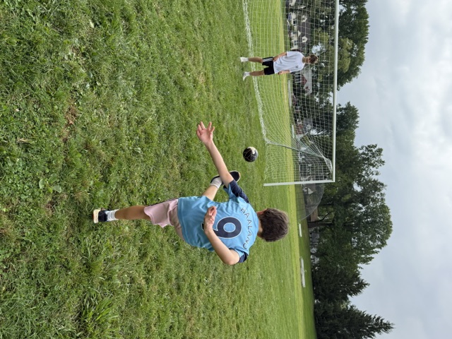 Sports Sitter running a soccer kicking drill