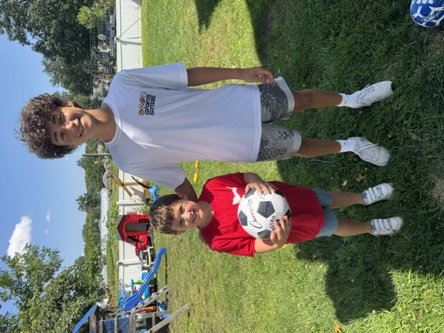 Sports Sitter coaching one-on-one volleyball
