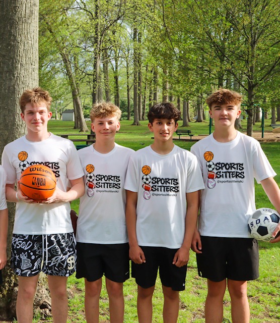 Sports Sitters with basketball and soccer ball at the park