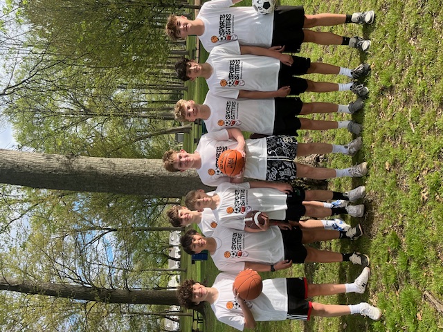 Sports Sitters with basketball and football at the park